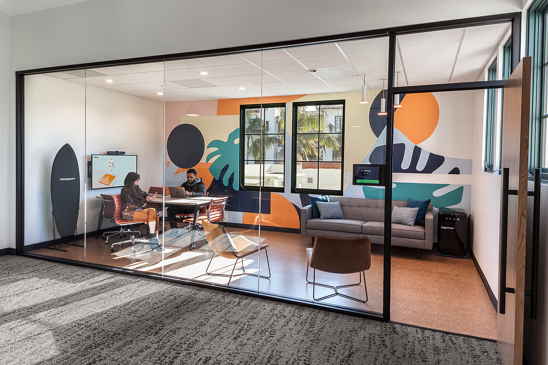 Workspace with modern furniture and glass wall