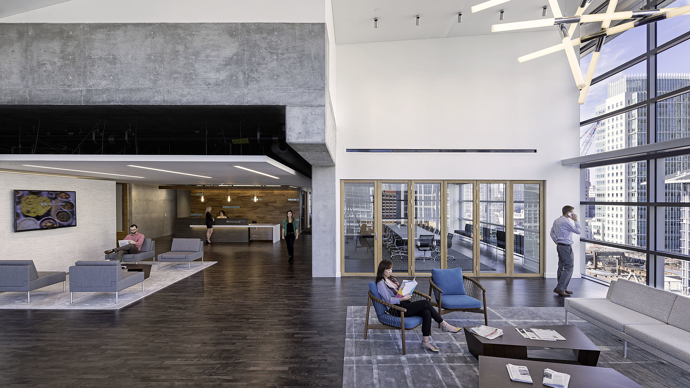 Perkins and Coie law firm interior office space picture with people on a phone