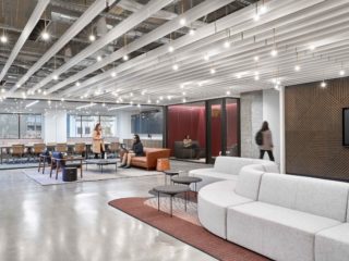 interior lounge space with white swirl couch in the forefront