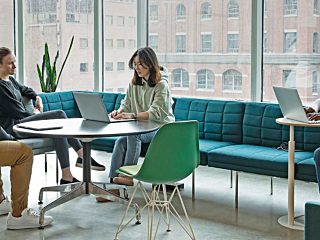 College students working at modern table and chairs