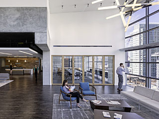 Perkins and Coie law firm interior office space picture with people on a phone